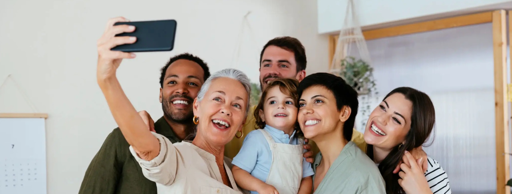 Diverse group of adults and children smiling together